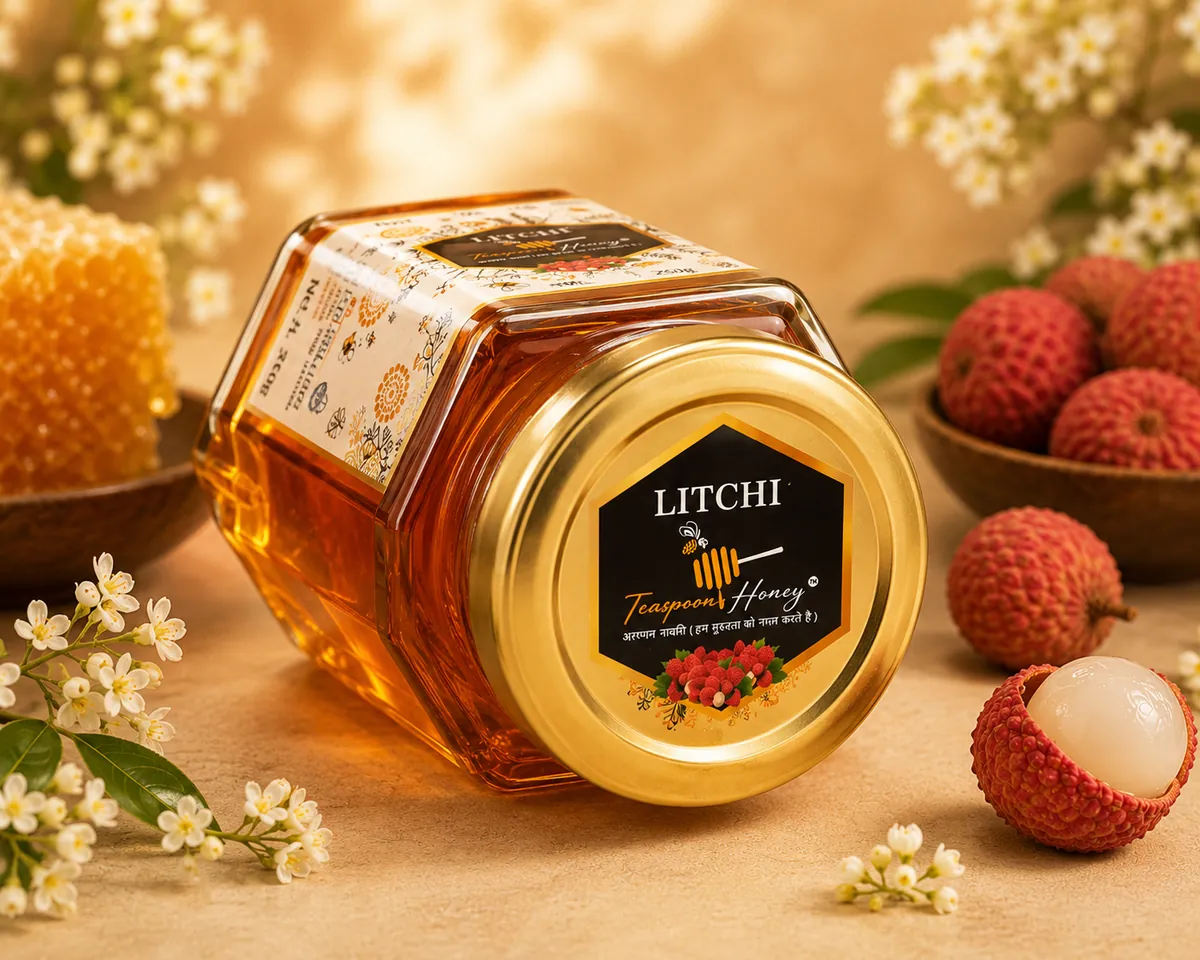 Teaspoon Honey Litchi raw honey jar resting on its side
