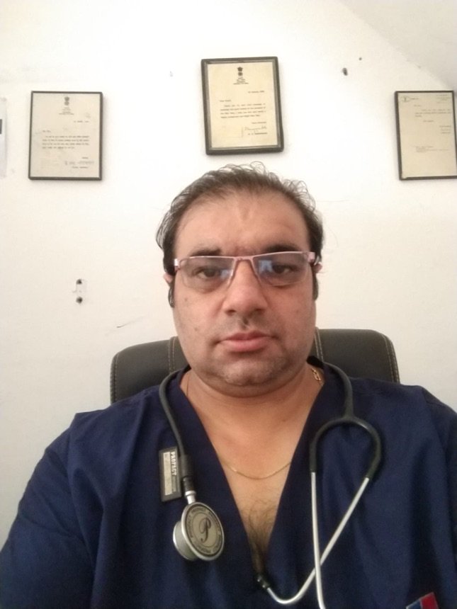 Dr. Mohit Sharma, founder of Teaspoon Honey, in his clinic